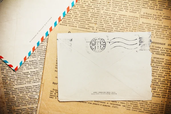 Vintage envelope on aged newspaper