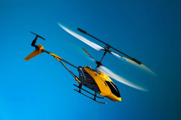 Flying remote controlled helicopter
