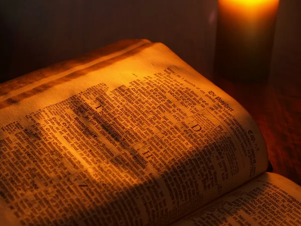 Bible in candle light