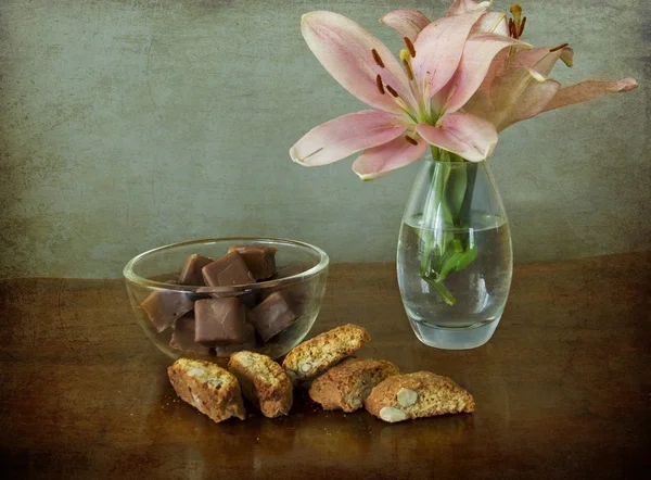 Vintage still life, cookies, chocolate and flowers