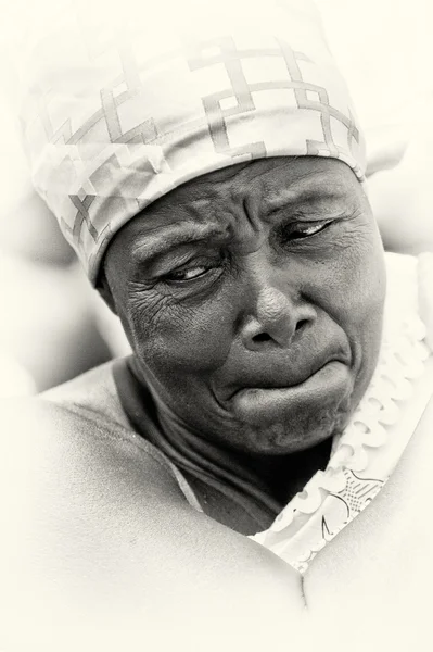 Sad old lady from Ghana