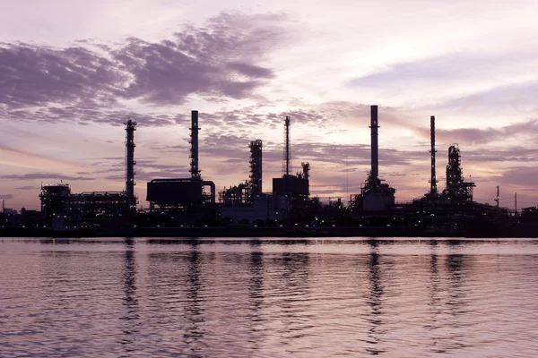 Sweet, Sunrise, oil refinery factory with reflection on the river.