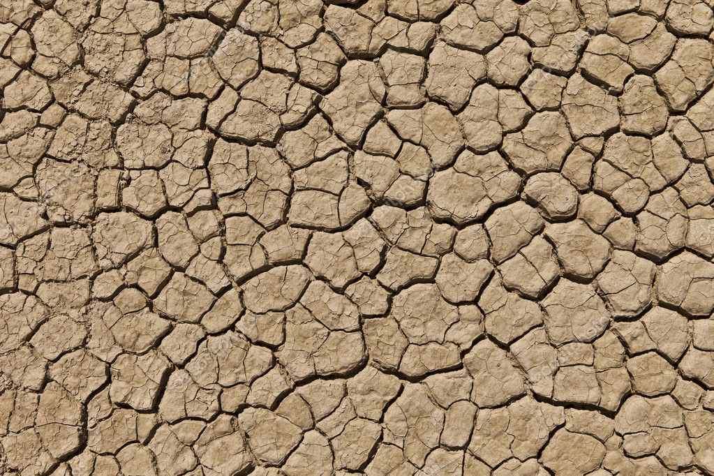 Seco agrietado suelo del desierto — Foto de stock © jamenp ...