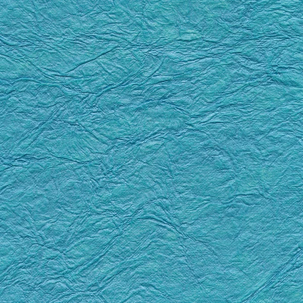 Blue paper background with pattern. Handmade paper