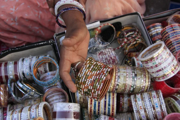 Hand showing bangels at indian market