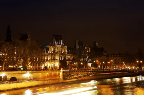 Paris from the Seine river at night river
