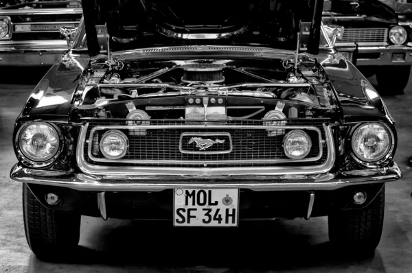PAAREN IM GLIEN, GERMANY - MAY 26: Open hood of the car Ford Mustang (Black and White), 