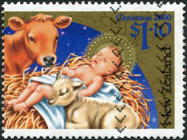 NEW ZEALAND - CIRCA 2000: A stamp printed in New Zealand, is dedicated to Christmas, depicts Baby Jesus, cow, lamb, circa 2000