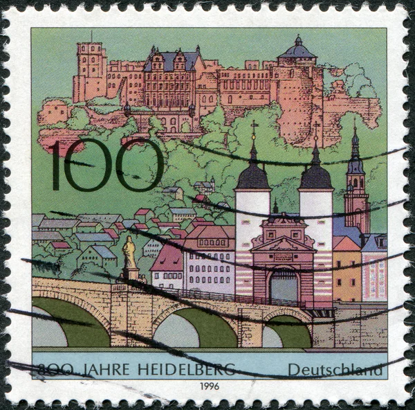 GERMANY - CIRCA 1996: A stamp printed in Germany, is dedicated to the 800th anniversary of Heidelberg, shows the old bridge to the city gates, the castle and the Church of the Holy Spirit, circa 1996