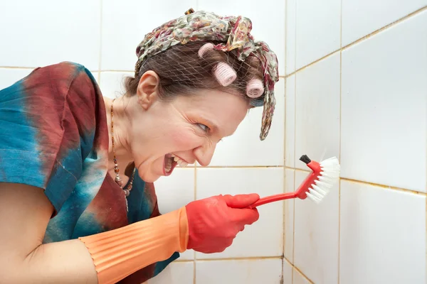 Angry woman cleaning