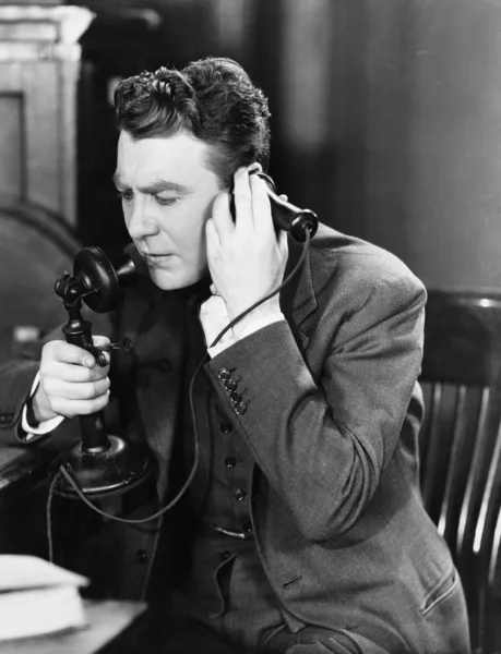 Man talking on telephone