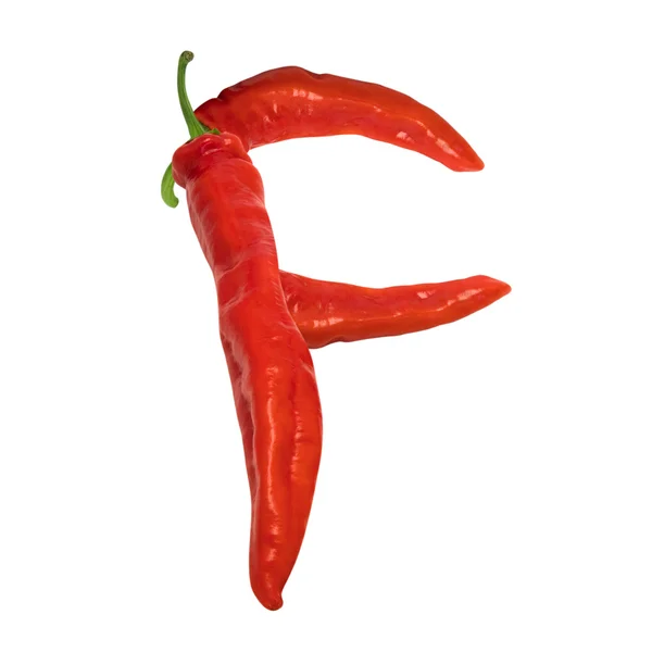 Brief f samengesteld uit rode chilipepertjes — Stockfoto