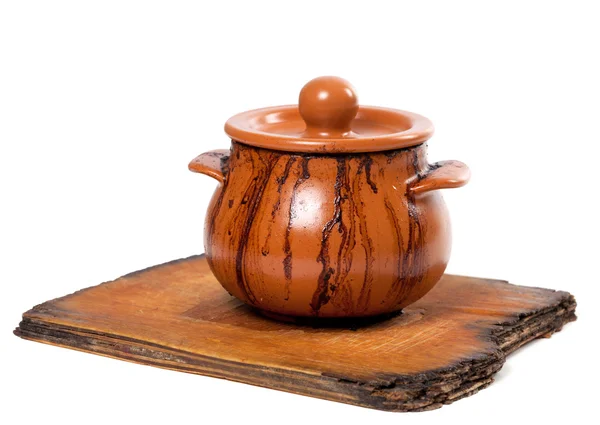 Pote de cerâmica sujo na prancha de cozinha velha — Fotografia de Stock