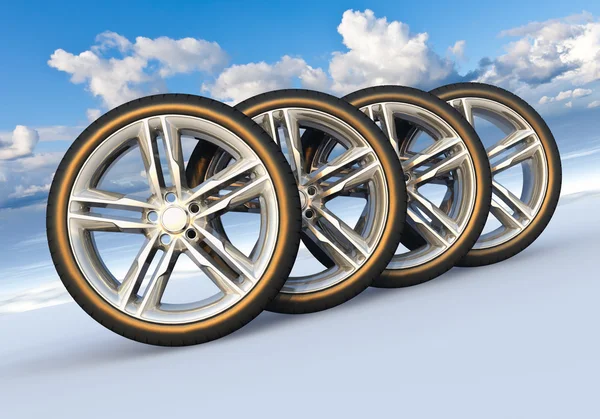 Набор автомобильных колес в снежном ландшафте — стоковое фото
