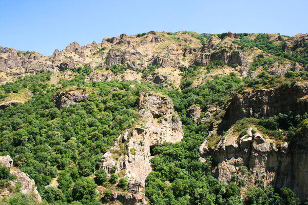 Armenian landscape with mountains, rocks and forest.