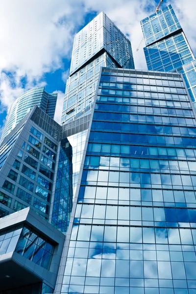 Modern skyscrapers and reflections of the clouds — Stock Photo, Image
