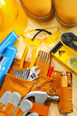 Composition of carpentry tools on wooden boards clipart