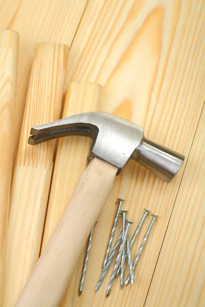 Hammer on planks and nails — Stock Photo, Image