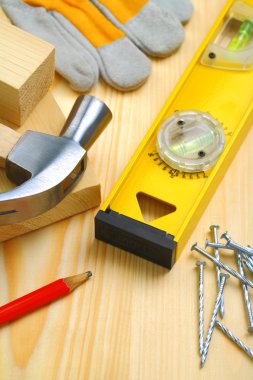 Construction tools and materials on table clipart