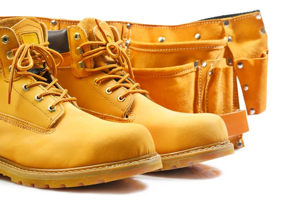 Pair of working boots and tool belt isolated — Stock Photo, Image