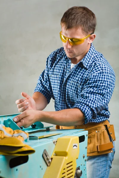 Men works on woodworking mashine Royalty Free Stock Photos