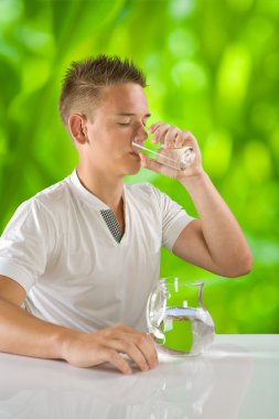 Boy drinking water clipart