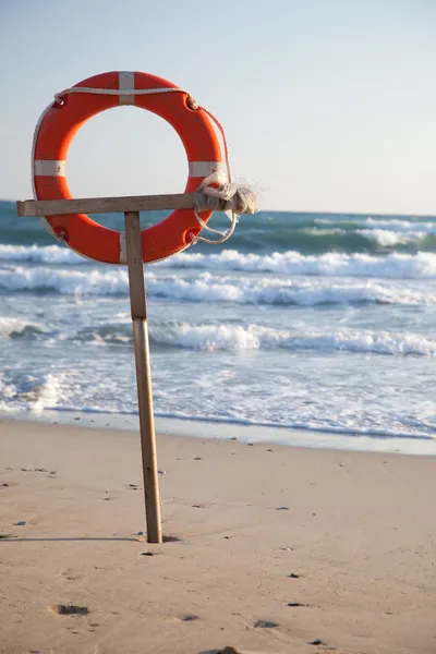 stock image Lifebuoy on a beach of the sea