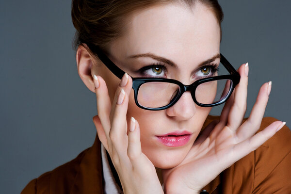 Beautiful business woman with glasses. Close-up portrait