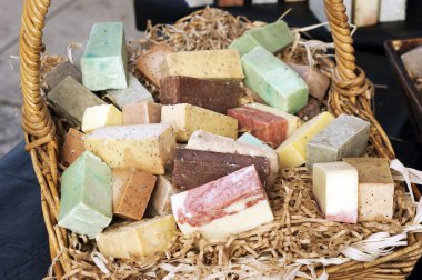 Handmade soap bars in a basket clipart