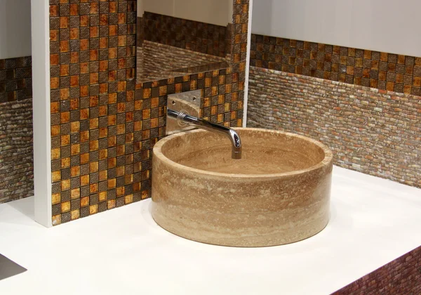 Stone washbasin and chrome tap — Stock Photo, Image