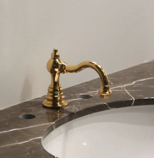 White and clean washbasin and golden tap — Stock Photo, Image