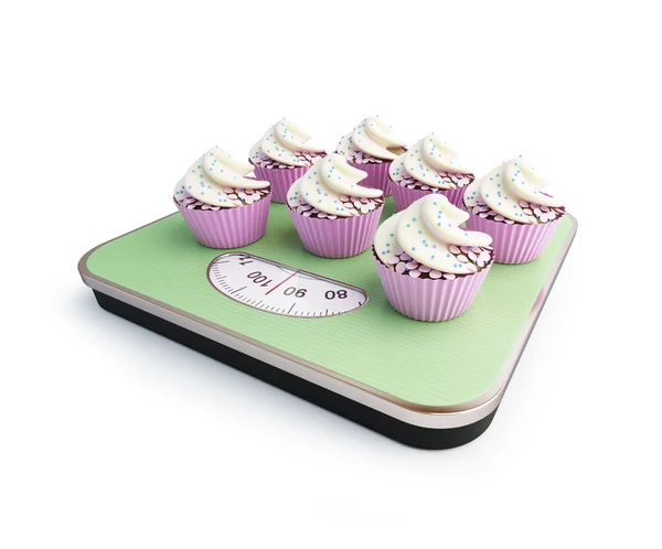 Bathroom scale with the cupcakes — Stock Photo, Image