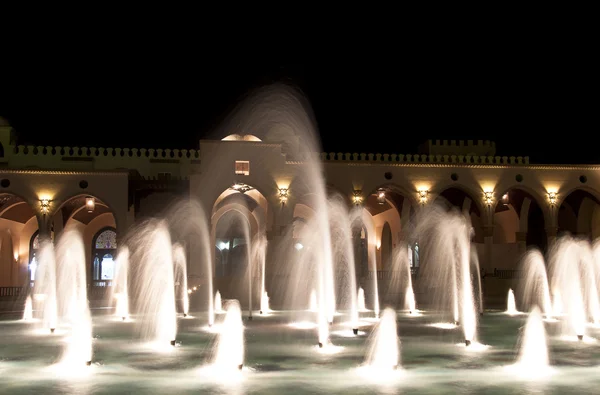 Dancing Multi Colored fountain at dark night — Stock Photo, Image