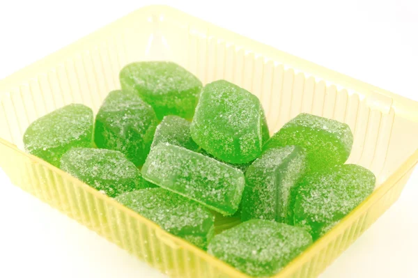 stock image Green fruit jelly in yellow case