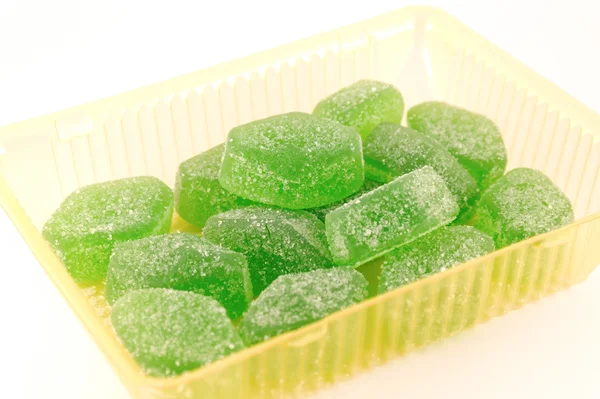 stock image Green fruit jelly in yellow case