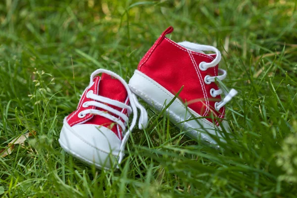 stock image Kids shoes on grass