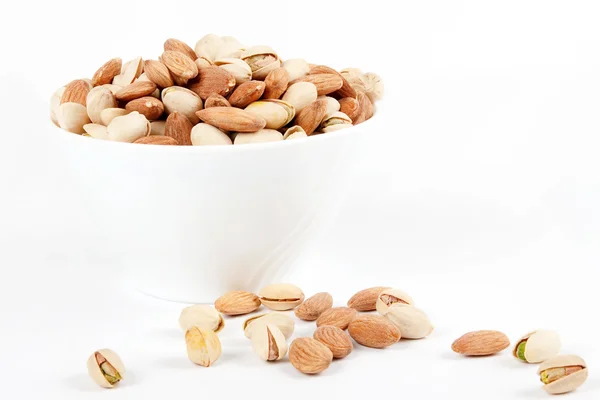 Bowl with almonds and pistachios — Stock Photo, Image
