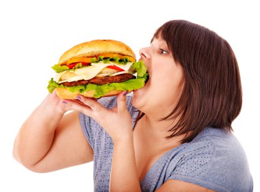 Woman eating hamburger. clipart