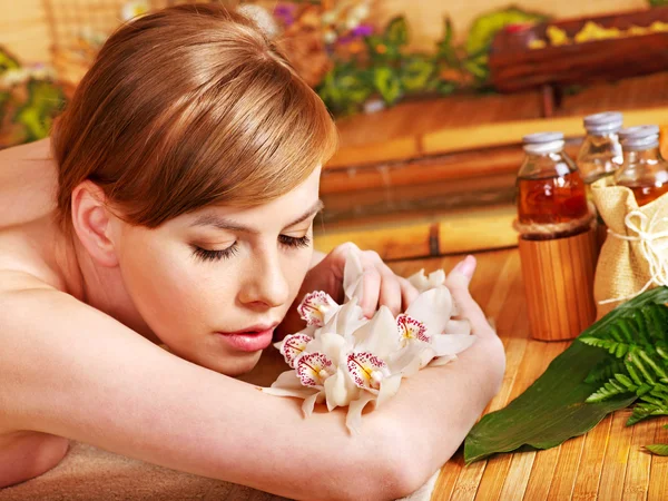 Woman getting massage in bamboo spa. — Stock Photo, Image