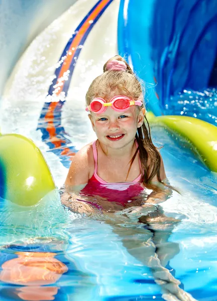 Child on water slide at aquapark. — Stock Photo, Image