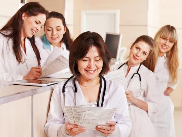 Group doctors at reception in hospital. — Stock Photo, Image
