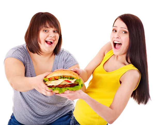 Kvinnor äter hamburgare. — Stockfoto