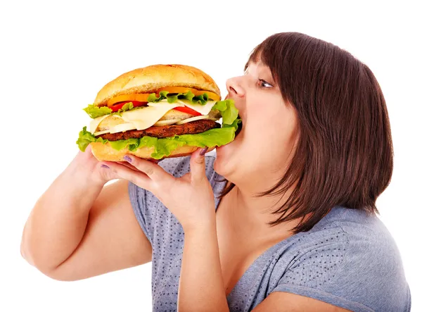 Mulher comendo hambúrguer . — Fotografia de Stock