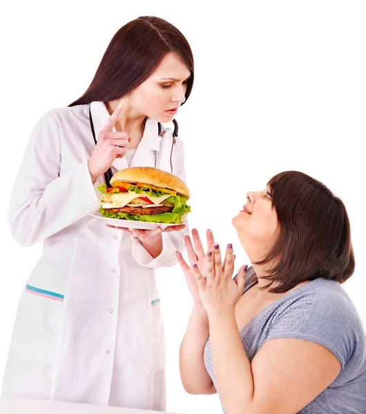 Femme avec hamburger et médecin . — Photo