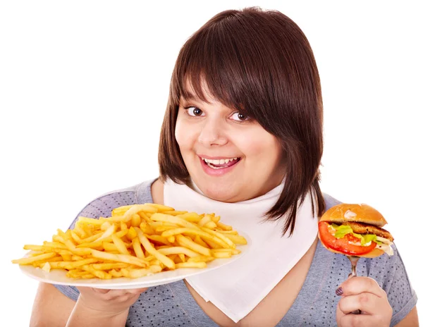 Överviktig kvinna äta hamburgare. — Stockfoto