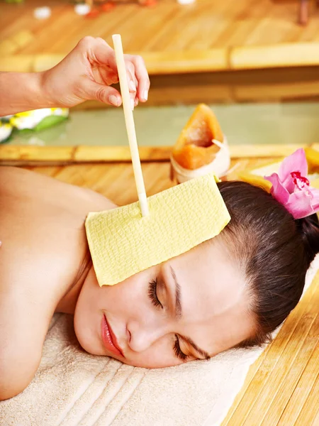 Woman getting massage with ear candle . — Stock Photo, Image