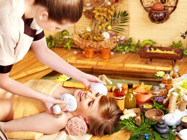 Woman getting facial massage. clipart