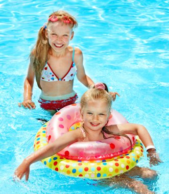 Children in swimming pool. clipart