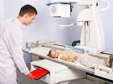 Doctor examining child patient. clipart