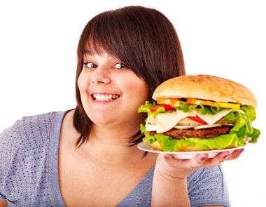 Woman eating hamburger. clipart